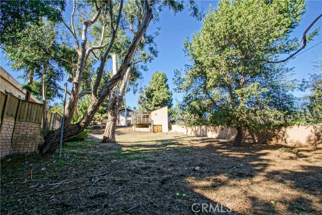 The back of the yard looking at the house/garage