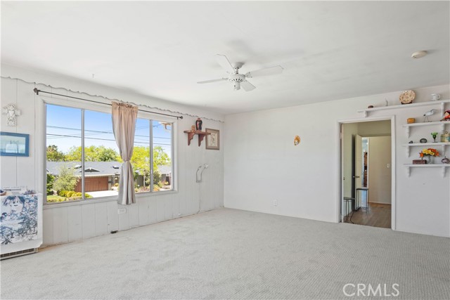Large west facing windows provide tons of natural light! Doorway leads into walk-thru bedroom (bdrm#2).