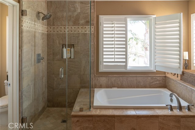 Master bath and shower with private toilet room