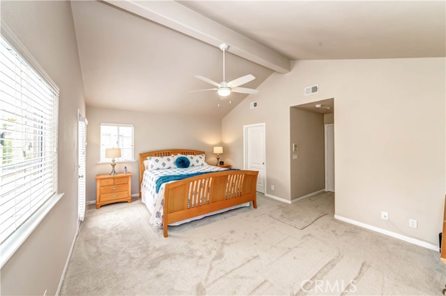 Master bedroom w/new carpeting, vaulted ceilings and rear balcony.  Balcony is actually the width of the home vs other homes that may have only a small area to step out on to.  This one you can actually enjoy.