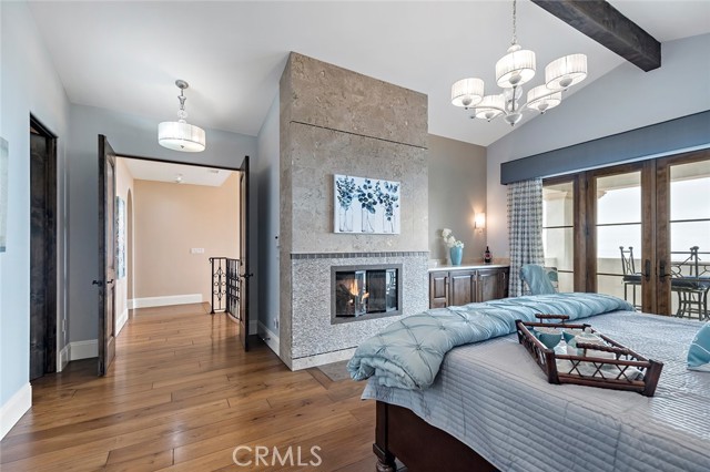 Master suite with fireplace and balcony