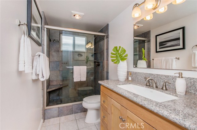 Three quarter bath on the first floor.. long sink, refreshed and well lit.