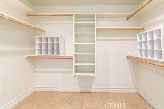 Primary bedroom walk in closet