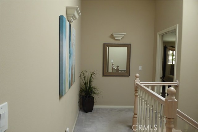 2nd Floor Landing with wall mounted light sconces.