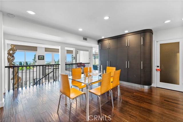 Huge casual eating area with built-in storage cabinetry. More views!