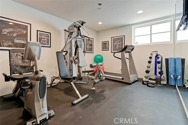 Fourth guest bedroom at lower floor level currently being used as a private gym.