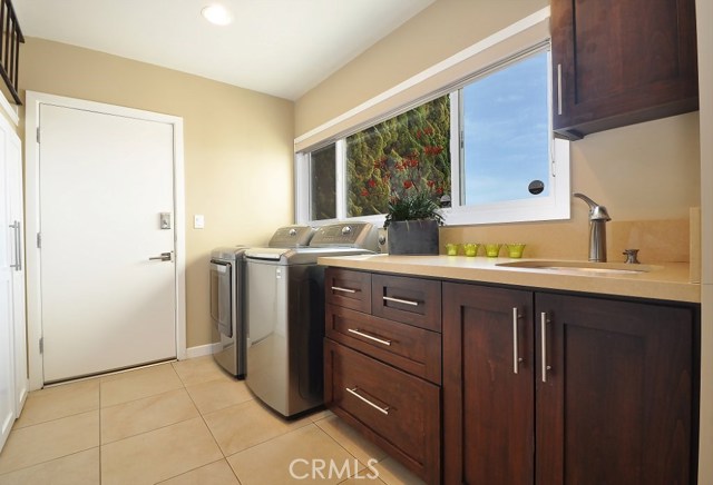 Huge Laundry Room with sink and even an ocean view.