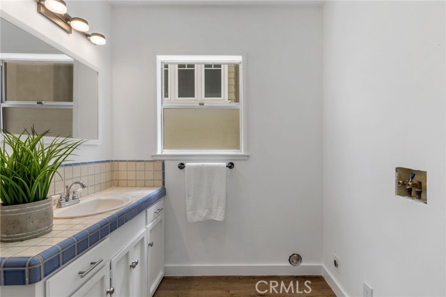 Half bath and laundry area is adjacent to the kitchen