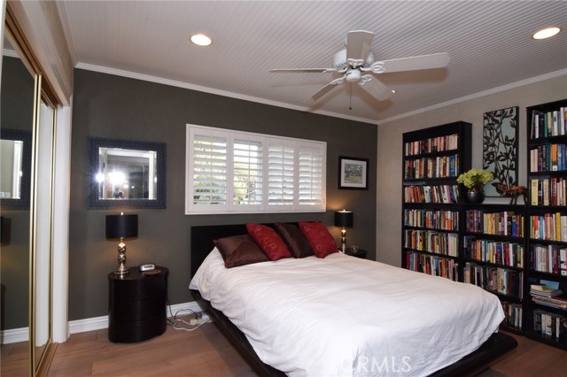 Bedroom #2, also has nautical wood ceilings, wood floors, and ceiling fan.  So adorable!