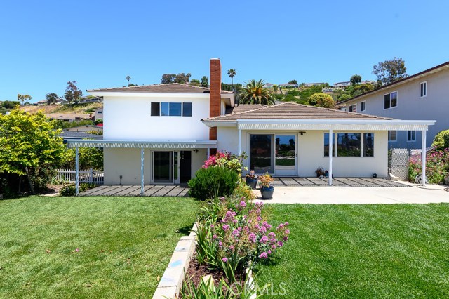 Two tiered backyard could be naturally defined into children's play area and adult's entertaining area.