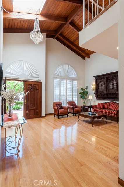 Grand entry has vaulted exposed-beam ceilings, big skylites, large south-facing windows and large Living Room.