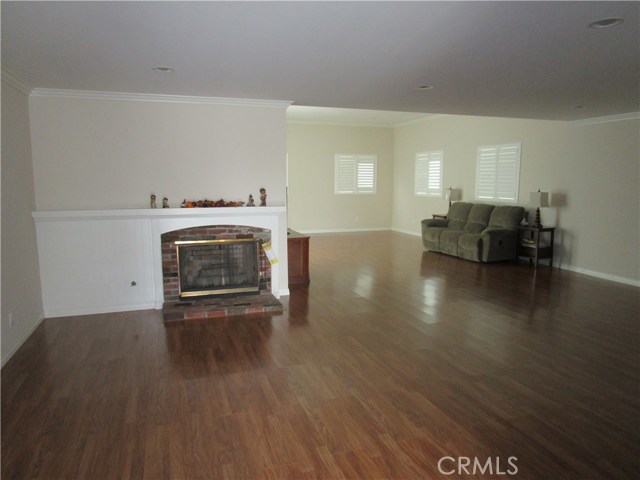 Ballroom-sized living room with fireplace.