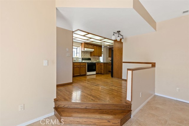 Eye catching step down wood floors to your expansive family room