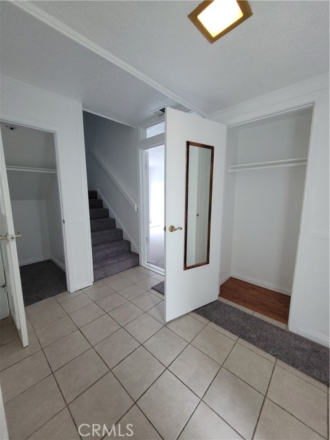 Front entry way - two closets, bathroom, entrance to bonus room and Garage