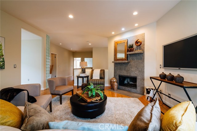 Living room with fireplace and hardwood floors