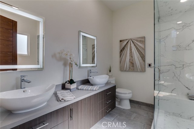 Master bath with double sink, steam shower & separate soaking tub