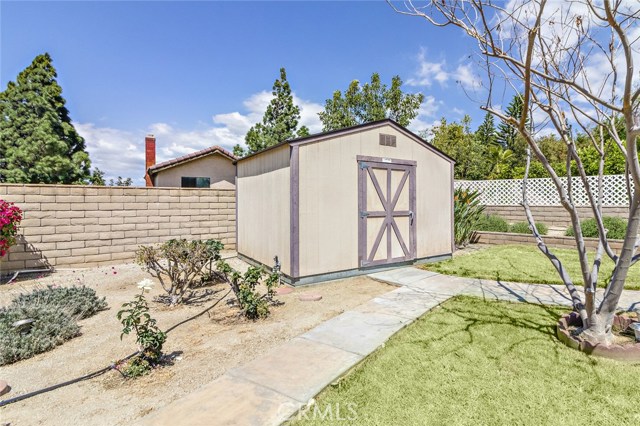 Large shed located in the corner of the yard