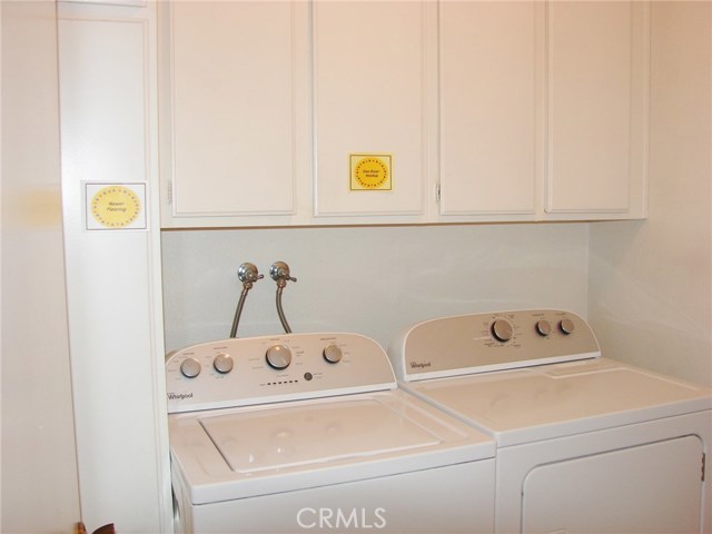 THERE'S A FULL INSIDE LAUNDRY ROOM JUST OFF THE KITCHEN. GAS DRYER HOOKUP AND CUPBOARDS FOR LAUNDRY SUPPLIES AND IRONING BOARD.