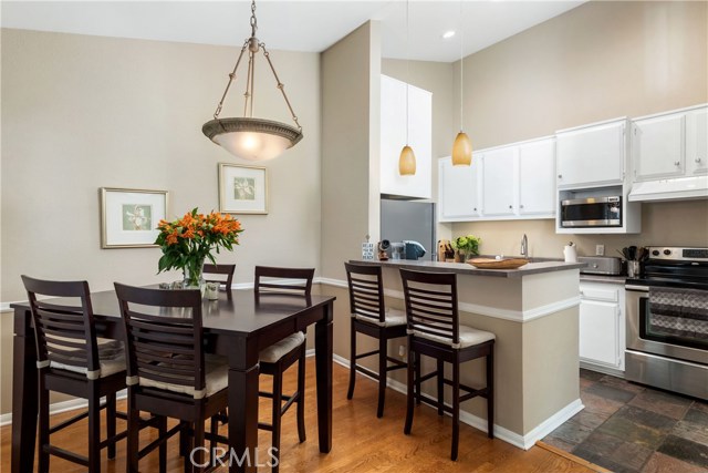 Welcome to your dining area, breakfast bar and kitchen.