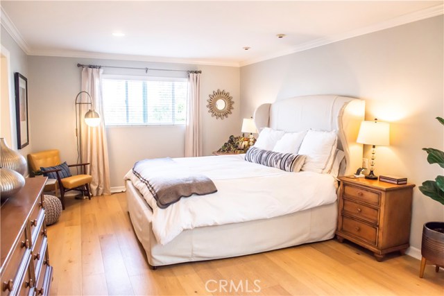 En suite master bedroom with balcony and French Oak hardwood floors.