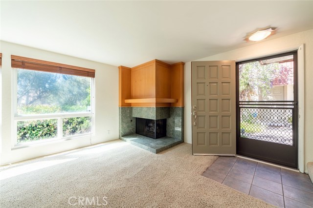 Living Room with view to the street from one of 2 picture windows