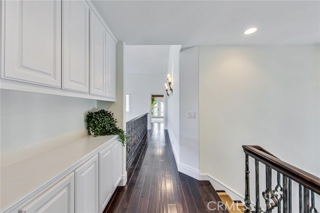 Top of staircase looking towards main bedroom + nursery or office/den.  Lots of built-in storage and lots of natural light.