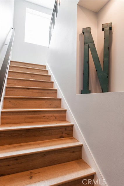 Stairway to 2nd level which houses family room and 4 bedrooms, 3 baths