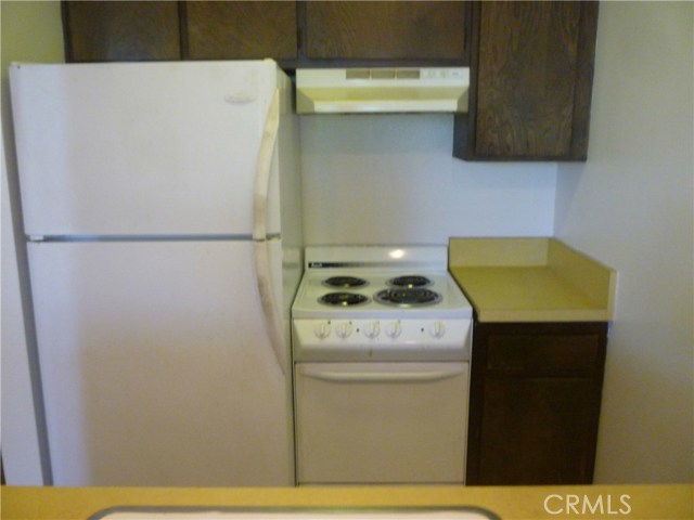 Refrigerator and electric stove included.