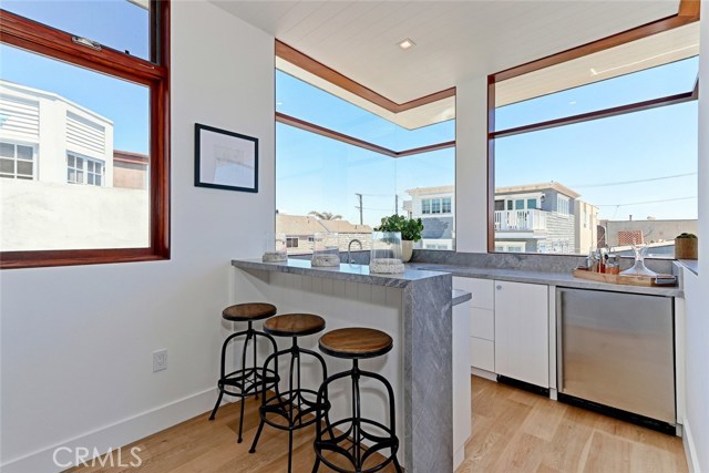 Wet bar with Bleu de Savoie countertop and backsplash