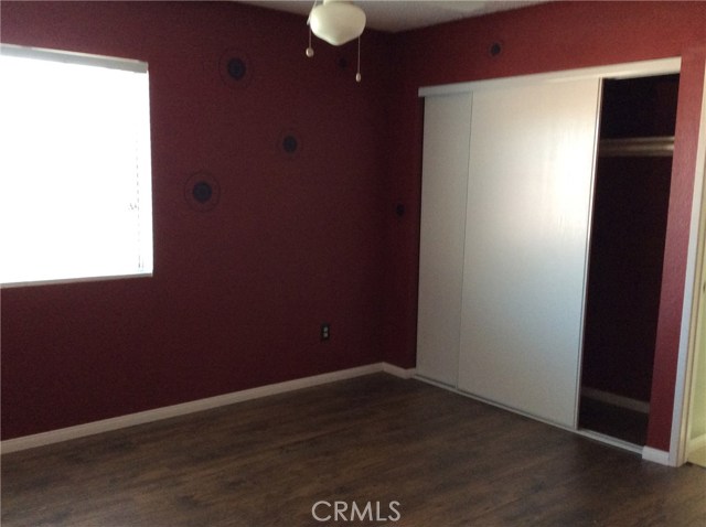 4th bedroom has new laminate flooring.