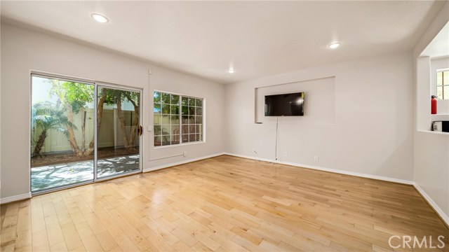 Large finished basement with kitchenette, full bath and generous walk-in closet make this room accommodating for guests, recreation, office or grandma.   Patio is in the background.
