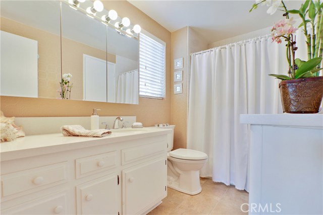 Master bathroom  with Quartz countertops, and access to the master bedroom.