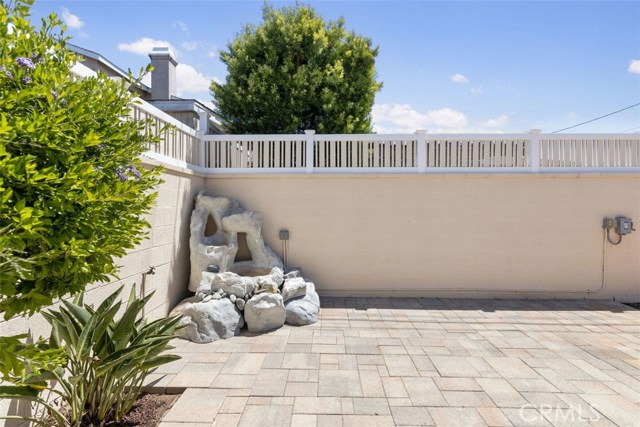 Beautiful fountain adds to the ambiance of this private yard