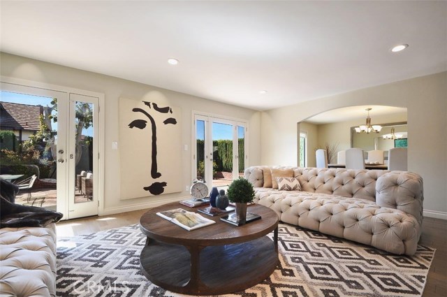 Living Room Opens to Formal Dining Room & Backyard