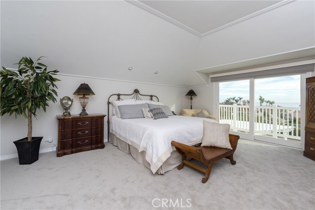 Master bedroom has tall ceilings, a romantic fireplace, and a slider opening to a killer ocean and Catalina Island view deck!!!