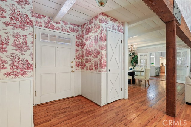 Entry way from the front door....look at those beautiful peg and groove wood floors!