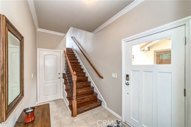 Front door entryway: Garage door, stairs leading to upper level where kitchen, living room and master bed & bath are located