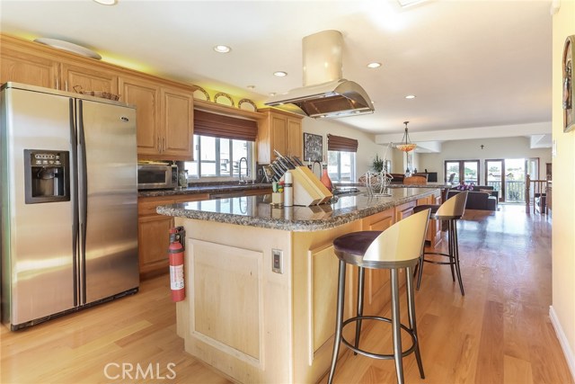 Spacious kitchen with Jen-Air appliances, large center island and counter overlooking the dining room & living room.