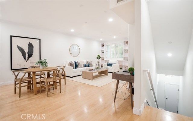 Open, airy and bright living space.  Stairway down to gym and garage.