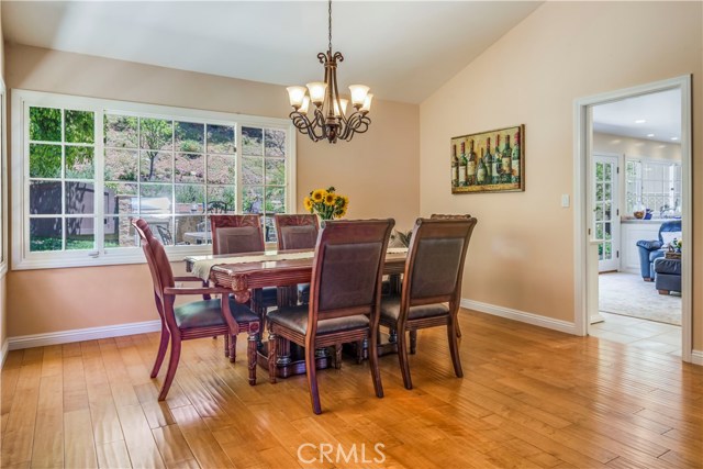 Dining room with large windows views the newly finish backyard and flows to the kitchen and family room area