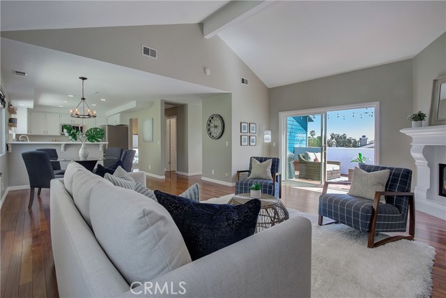 Living space flowing out to charming balcony!