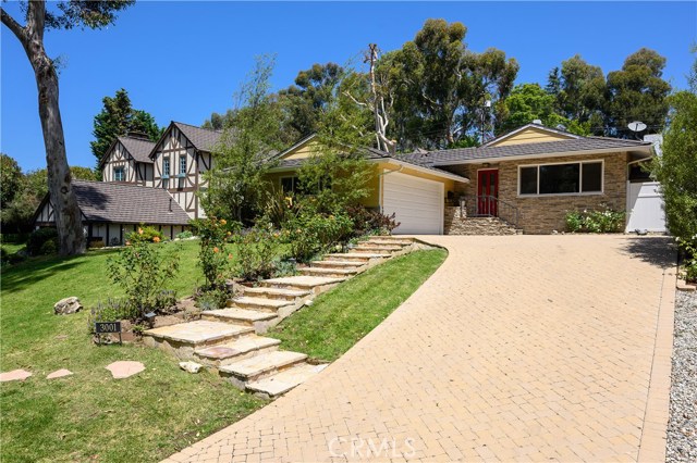 Brick paver driveway leads to your two car garage with epoxy floors and 220V for your plug in car.  There's plenty of off street parking for your guests.