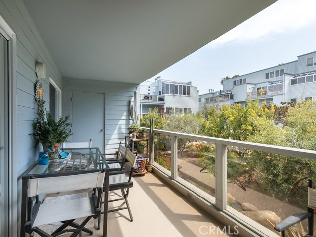 Spacious patio overlooks the serene courtyard and includes large storage closet.