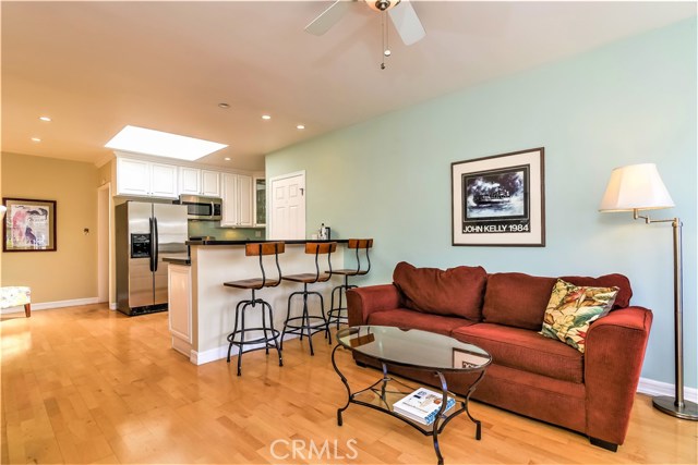 The living room has an adjoining breakfast bar counter