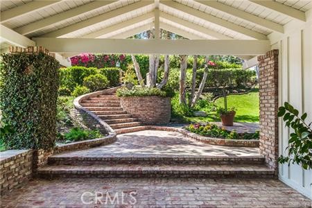 Lovely, elegant entry way. Large grassy area with mature trees.