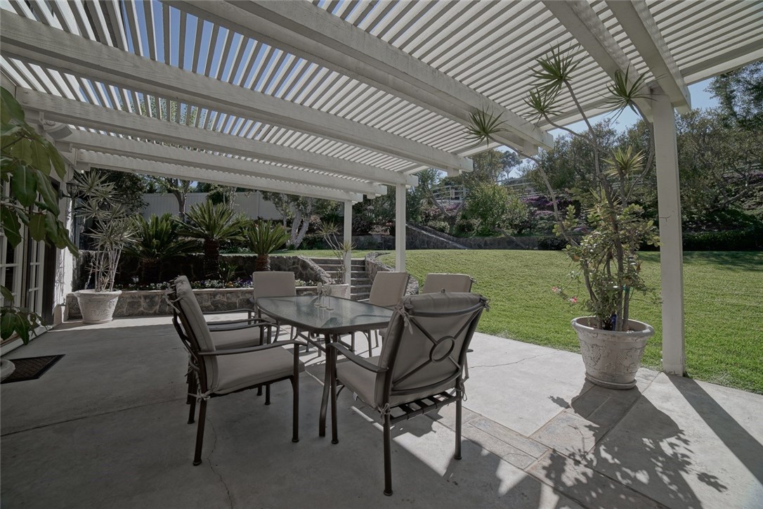 Family and friends will gather in this beautiful patio situated with lush grounds...