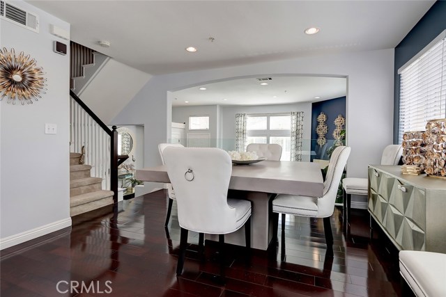 Centrally located formal dining area with hardwood floors.