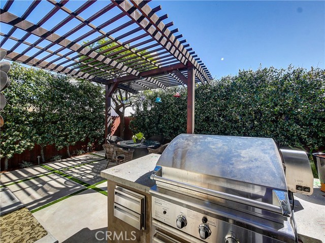 Outdoor kitchen with a pass through to the inside kitchen.
