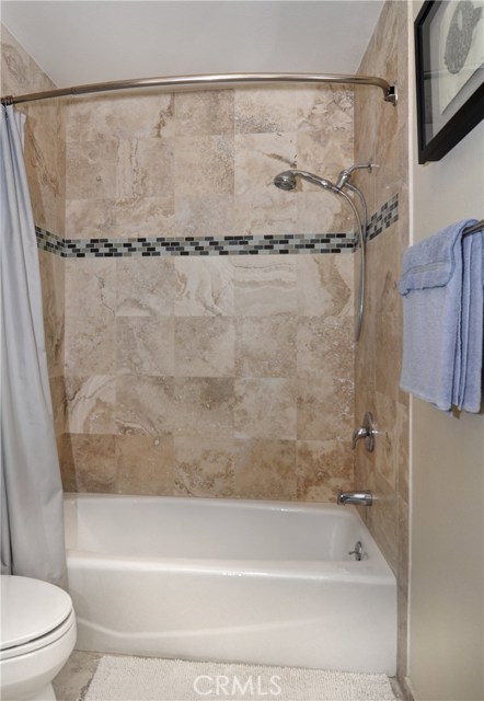 Master tub shower combination with designer tiles
