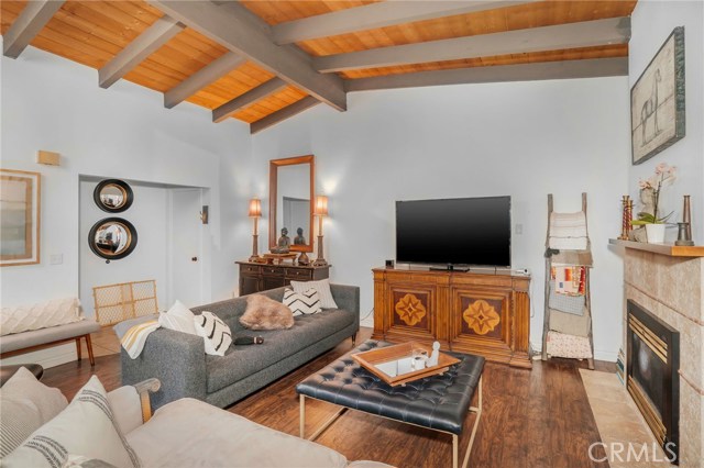 Another view of living family room with fireplace to cozy up to in winter